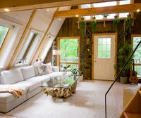 The loft under the skylights, door onto the deck
