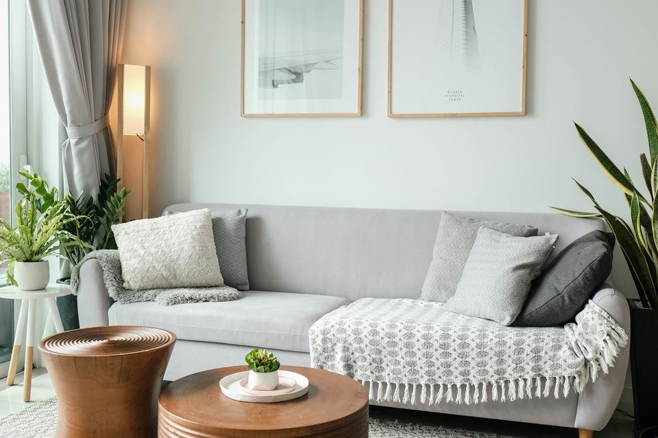 A living room with a low table and soft chairs