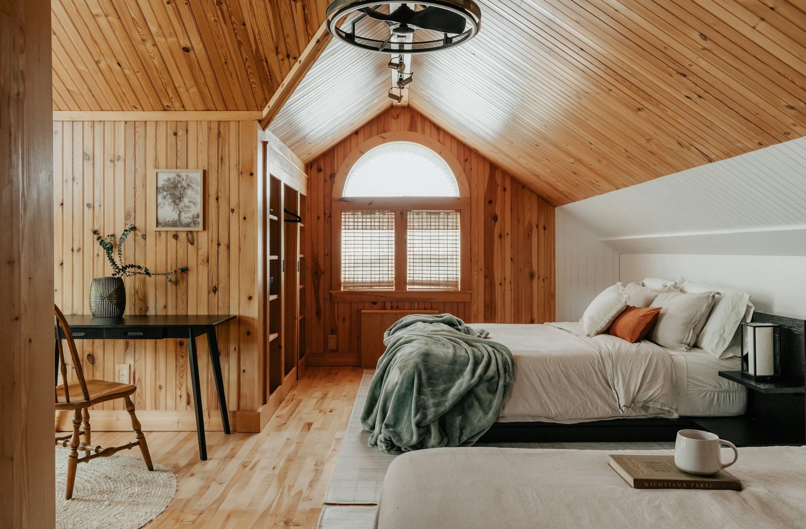 The bedroom under the pitched pine ceiling